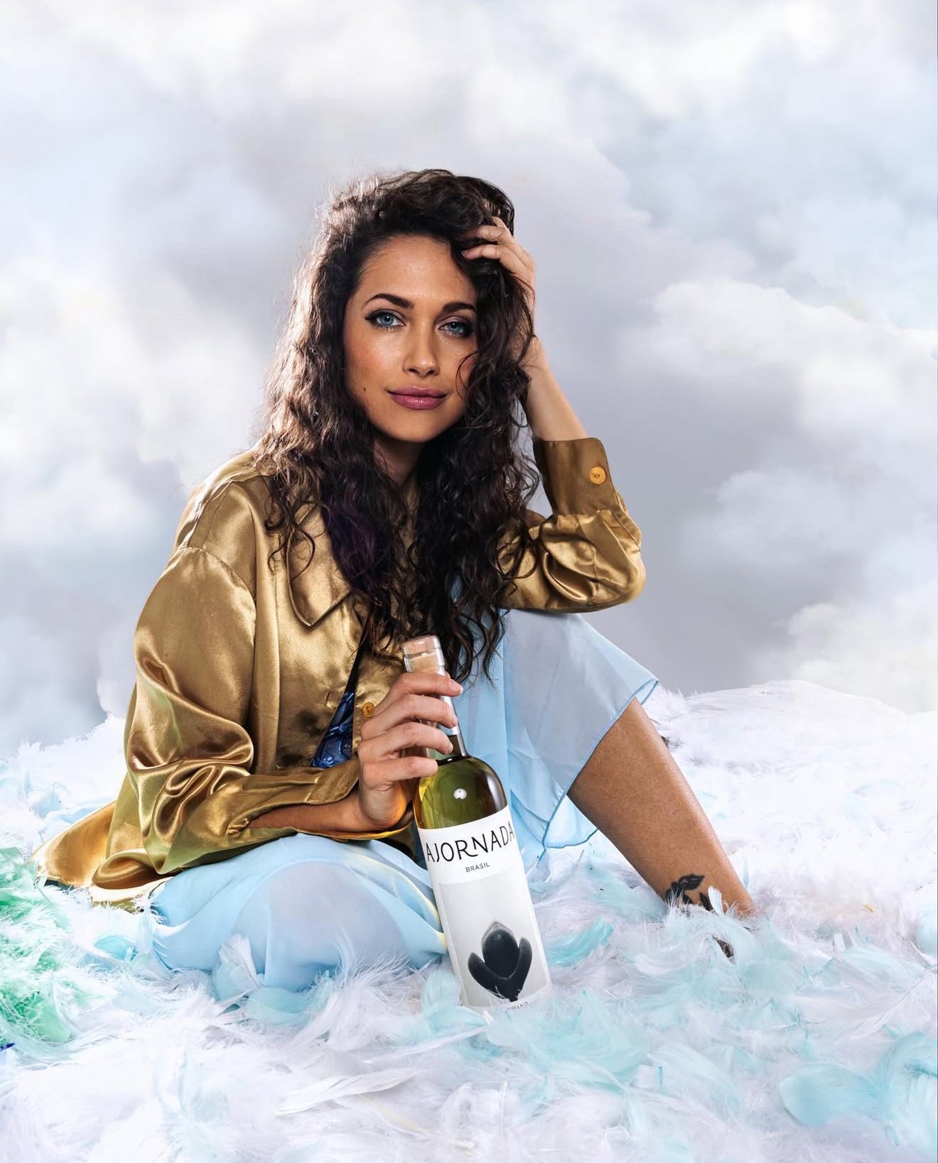 Maiara photographed with an AJORNADA wine bottle